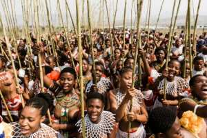Zulu maidens carrying the long reeds used in the ceremony. By RAJESH JANTILAL AFP