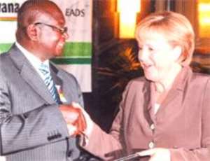 Dr Francis Appiah receiving the award from Dr Angela Merkel