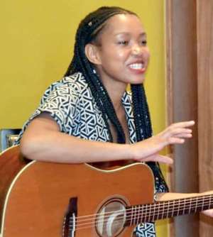 Barita on her guitar at the South African event