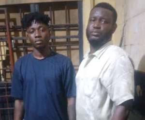 Kojo Owusu Koranteng aka Nana Dope and Eric Venator, alias Gangee in handcuff at the police station