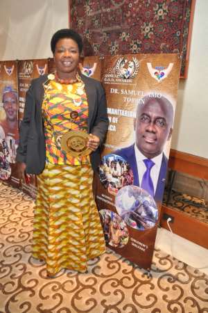 Spotlight - Dr. Tobbin Honored with Humanitarian Icon of Africa Awardat the United Nations