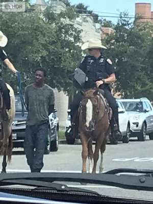 Black man with rope by the Texas Police