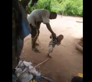 Man mercilessly beating a baby