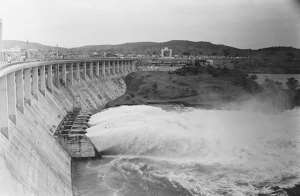 The sluice gates open at the Owen Falls Dam across the White Nile in Uganda on 14 October 1962.  - Source: