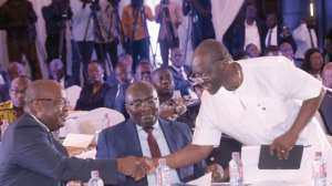 Mr Ken Ofori-Atta right shaking hands with Dr Ernest Addison as Vice-President Dr Bawumia looks on at the ceremony