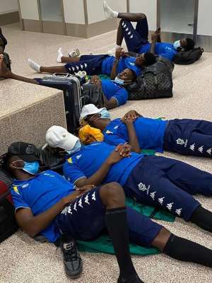 Gabon teammates sleeping on the floor at the Gambia airport