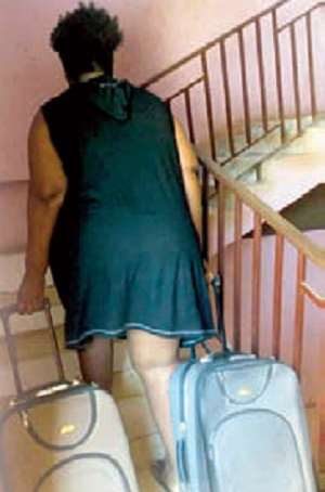 A student returning to the hall with her luggage