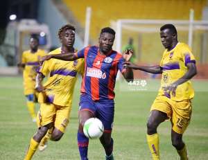 Asamoah Gyan in action for Legon Cities FC against Medeama SC. Photo Credit442gh.com