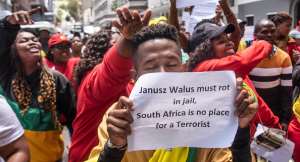 Protesters demonstrate outside the high court in Cape Town against parole for Janusz Walus. - Source: Brenton GeachGallo Images via Getty Images