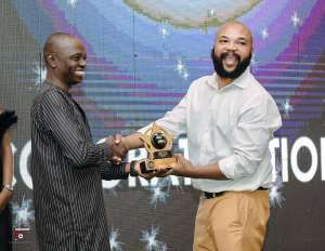 Emeka Okpara  right receiving his award.