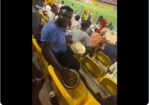 Hearts of Oak supporter spotted eating banku and okro soup at stadium during matchday Video