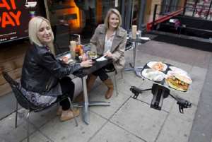 A drone brings food to customers at YO! Sushi Restaurant in London- Photo credit: Neil Hall  Reuters