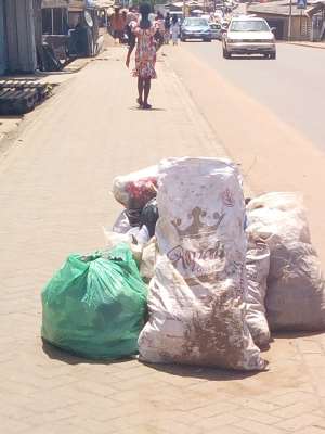 Photo by Pamela - Refuse disposed at Odorkor-Official Town on pavement