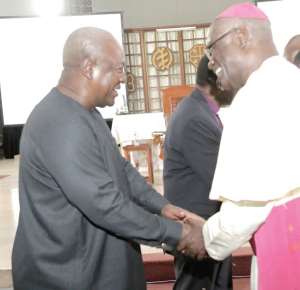 Former President John Dramani Mahama left exchanging pleasantries with Most Rev. John Bonaventure Kwofie, Metropolitan Archbishop of Accra at the 'Conversation in the Cathedral' held at the Holy Spirit Cathedral in Accra