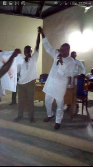 Kwasi Bonzo holding Mr. John Asmah hands
