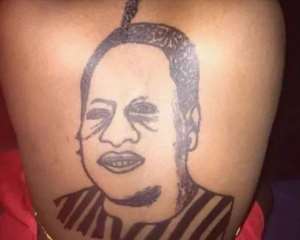 Woman Tattoos John Mahama At Her Back