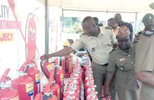 Personnel of the Fire Service checking out the products on display