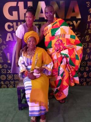 The Divisional Queen mother of the Bongo-Feo with her received
