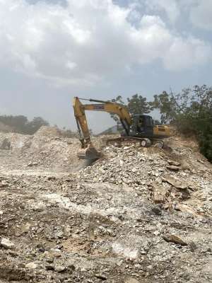 An excavator digs into the gravel at Omanjor Quarry site Photo Credit Afia Agyapomaa Ofosu