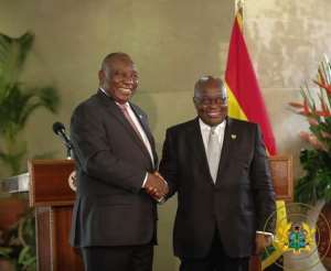 The two Presidents in a handshake after the signing ceremony