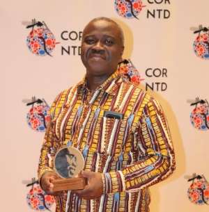 Professor John Owusu Gyapong with his award