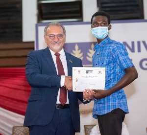 Hon. Ghassan Yared presenting a certificate