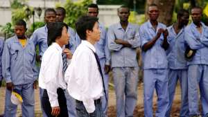 New colonialism: African workers waiting for the orders of new colonial masters, the Chinese