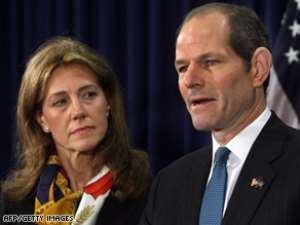 Gov. Eliot Spitzer, wife at his side, announces he is stepping down
