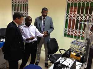 The VC of UMAT, Prof Jerry Kuma, and a teacher of the Faculty of Engineering, showing the Engineering laboratory to the French Ambassador