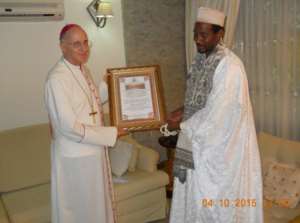 His Excellency Jean Malie Speich the Ambassador of Vatican Embassy in Ghana receiving citation from the Spiritual Leader of Tijaniyya Muslim Council of Ghana Sheikh Abul- Faidi Abdulai Ahmed Maikano.