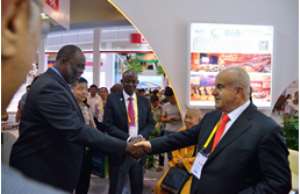 Dr. Spio Garbrah shaking hands with Ghazi Abu Nahl at the CIFIT 2015 grand opening, looking is Mr. Doni-Kwame