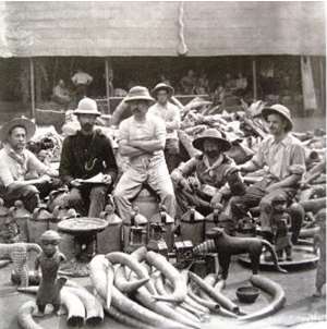 British soldiers of the infamous Punitive Expedition of 1897 proudly posing with looted Benin artefacts.