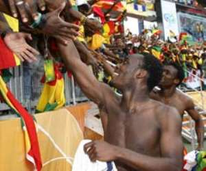 Ghana's Michael Essien is congratulated by fans after their victory over the USA