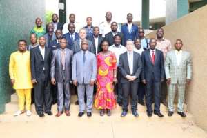 Participants and officials in a group photograph