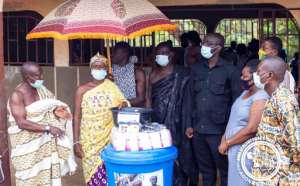 Queen Mother of Agona donates PPE to 10 basic schools