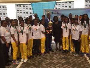 GRA Female Team Presents Trophy To Management