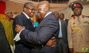President Nana Akufo-Addo R sharing a laughter with Speaker Alban Bagbin L