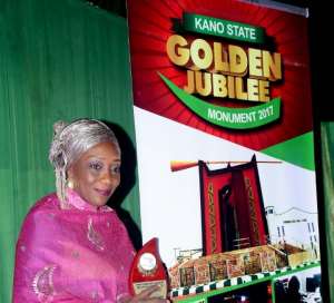 Hajiya after winning and receiving a Merit Award