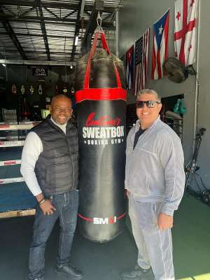 Co-manager of John Laryea, Sammy Anim Addo meets Peter Kahn at Centenos SweatBox Boxing Gym, Florida