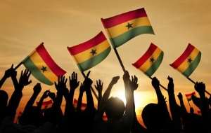 People holding the flag of Ghana.
