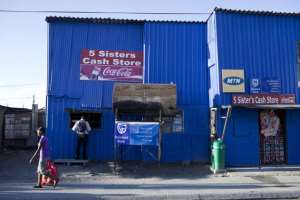A corner shop in Khayelitsha, Cape Town. Small businesses could benefit from sharing resources, like electricity. - Source: Photo by Per-Anders PetterssonGetty Images