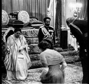Queen Elizabeth and Prince Phillip bowing before the real original African Royalty