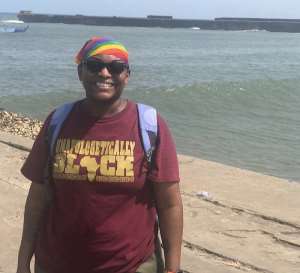 LaSonya at the beach of Jamestown. The pier in the back is the point of no return for the Africans of the small fishing town.