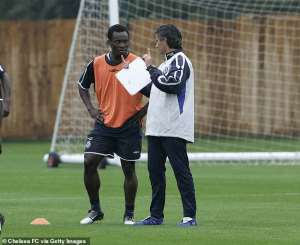 Michael Essien with Jose Mourinho