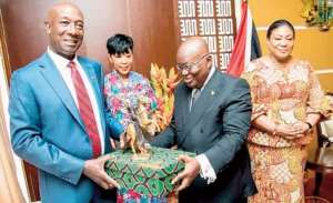 President Akufo-Addo presenting a gift to Prime Minister Dr. Keith Rowrey