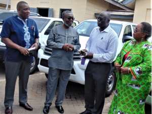 Dr. Nicholas Kanlisi, Rep of Columbia University second from right hands over keys of the seven cars to Dr. Anthony Nsiah-Asare, Director General DG of Ghana Health Service third from right. Looking on are Dr. Gloria Quansah, Deputy DG and Dr. Koku Awoonor Director PPME