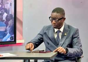 Chief Executive Officer of the Ghana Investment Fund for Electronic Communications (GIFEC), Dr. Rashid Tanko Computer