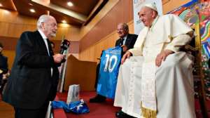 Pope Francis was an avid football fan who met a host of star players, managers and officials. He spoke with Napoli owner Aurelio De Laurentiis at an event on May 25, 2023. Vatican Media via Vatican Pool/Getty Images