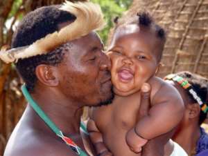 A happy father gives his child a kiss on the cheekBJust mention the name Africa in Europe; everyone thinks itrsquo;s a continent with ethnic conflict, wars, civil unrest, slavery, and diseases.B