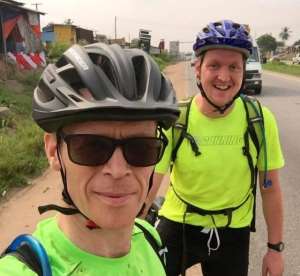 British High Commissioner to Ghana, Iain Walker and a friend cycling